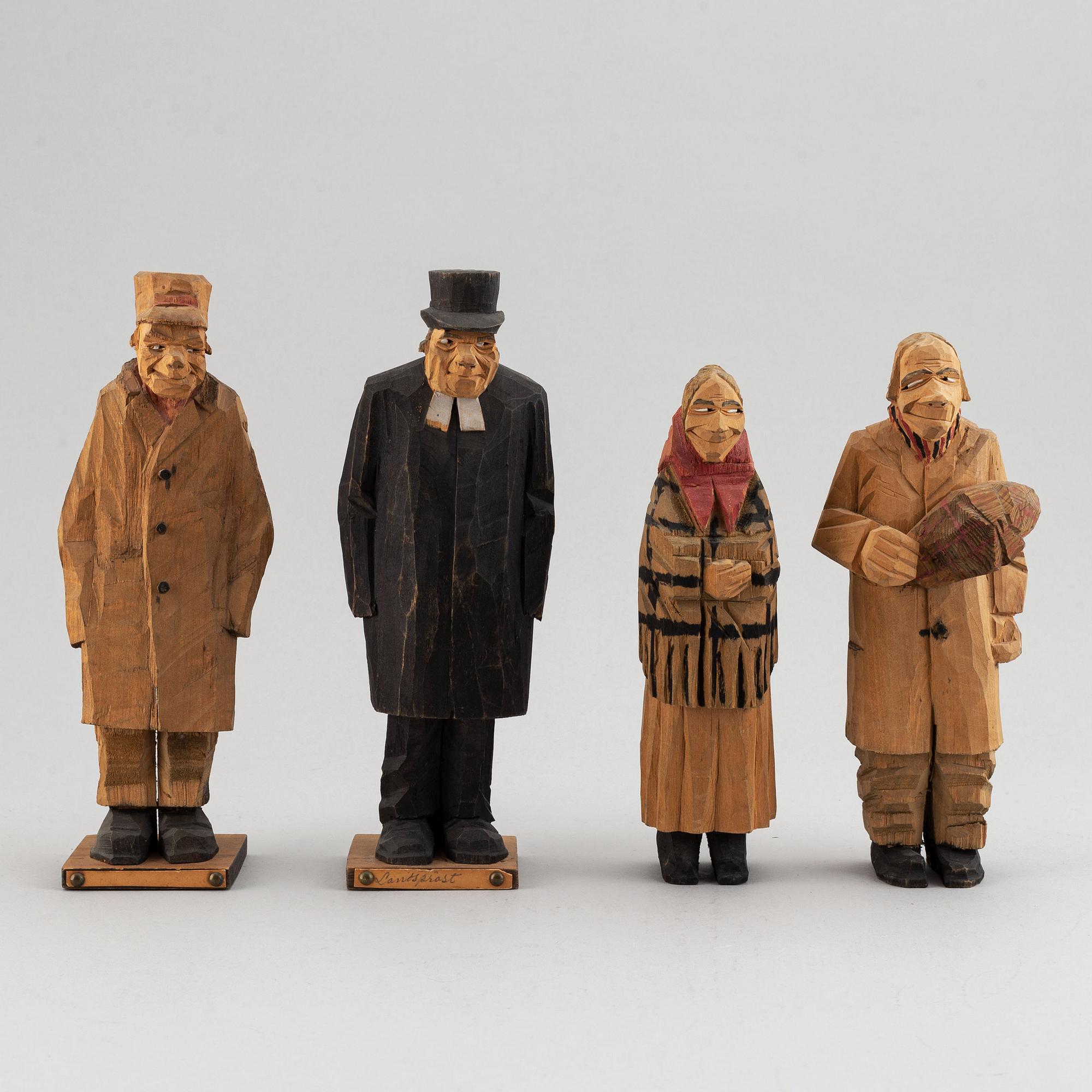Four Carl Johan Trygg wooden sculptures, two signed and dated 1918.