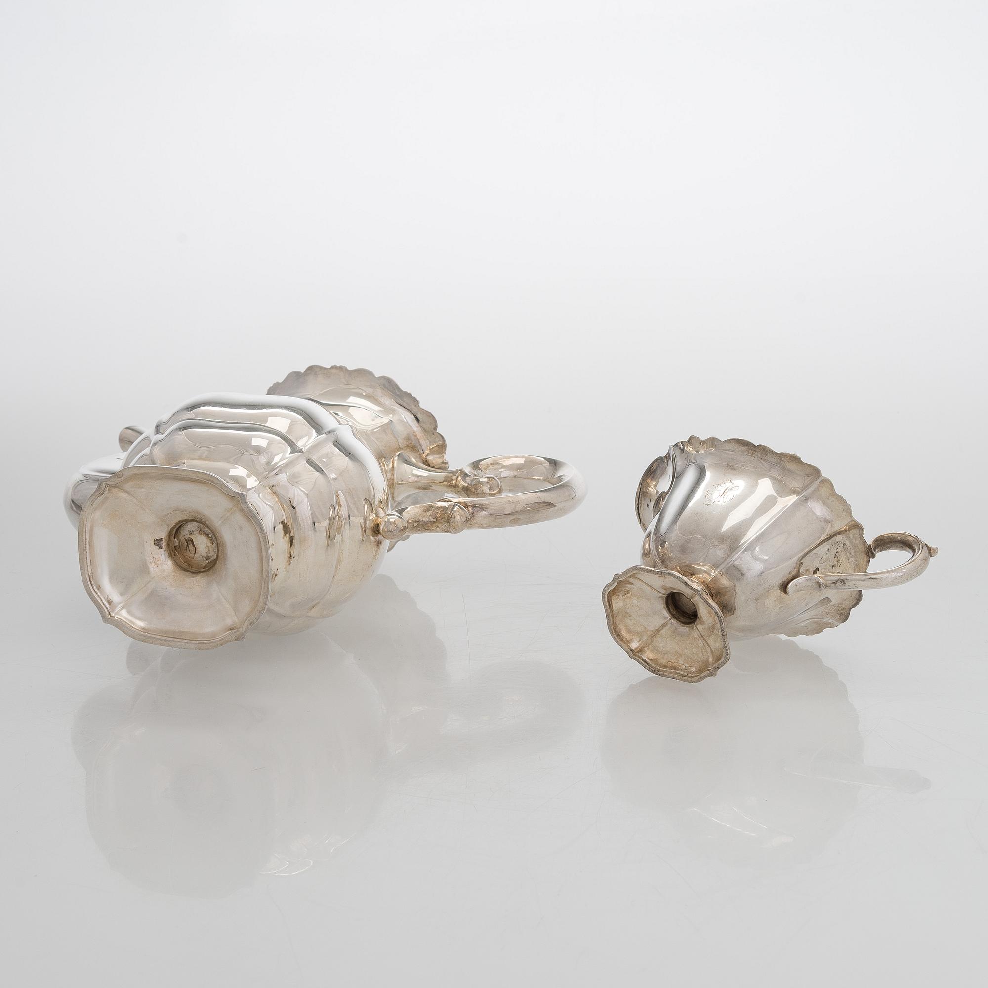 A silver coffee pot, sugar bowl, cream jug, and sugar tongs, Finland 1926-49.