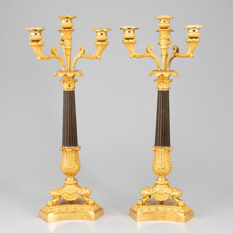 A pair of late empire ormolu candelabra, first half of the 19th century.