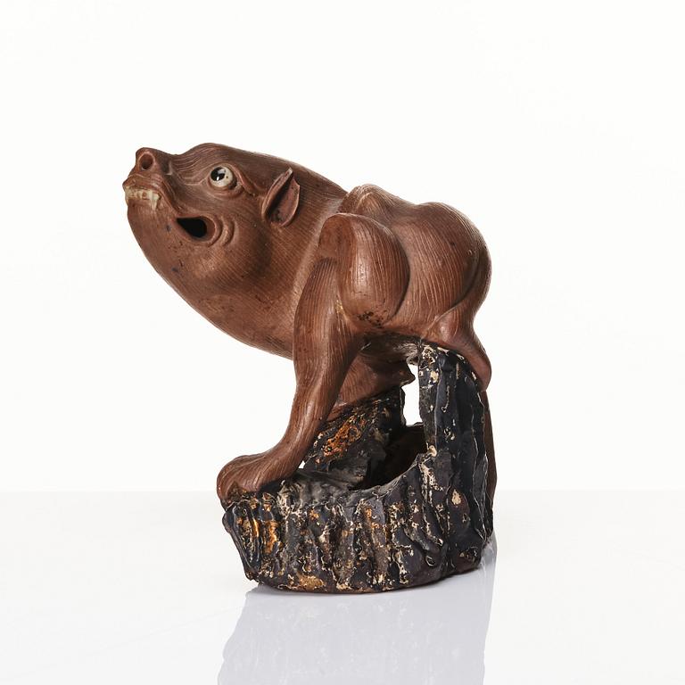 A pottery figure of a mythical beast, Qing dynasty (1644-1912).