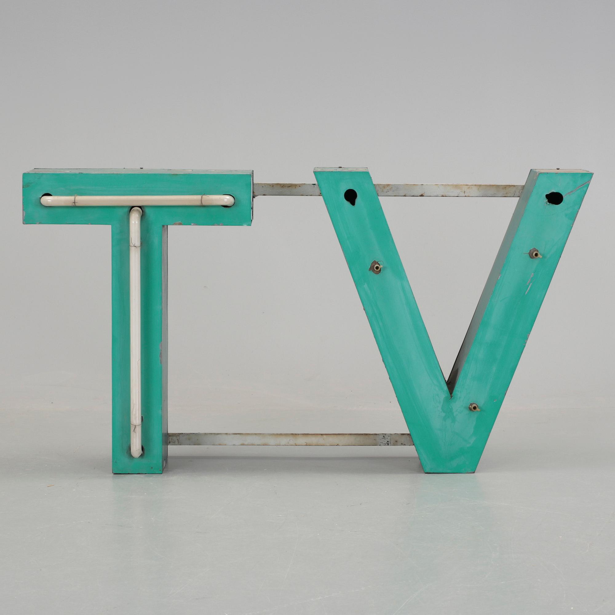 FASADSKYLT. "TV", 1900-talets första hälft.