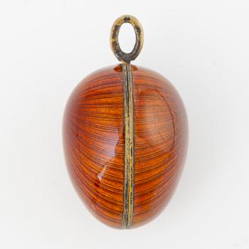 Pendant, in the form of an egg, A. Tillander, gilded silver and red enamel, Finland 1977.