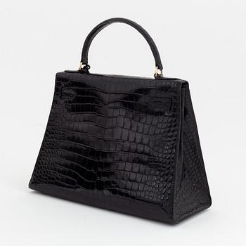 1962 black alligator 'Kelly' handbag by Hermès.