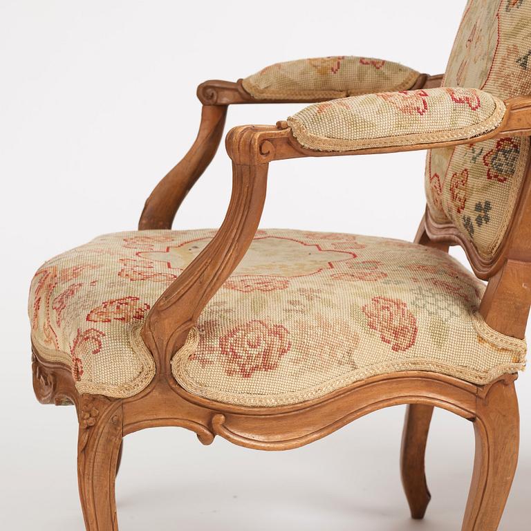 A matched pair of French Louis XV armchairs, mid 18th century.