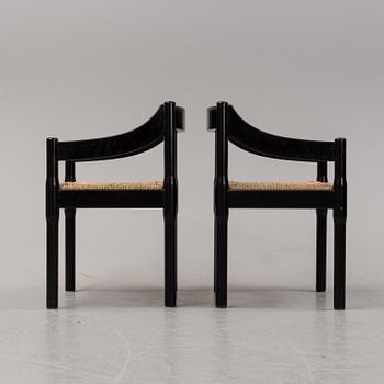 Vico Magestretti. Four black lacquered chairs with rope seats, "Carimate". Cassina, Italy.