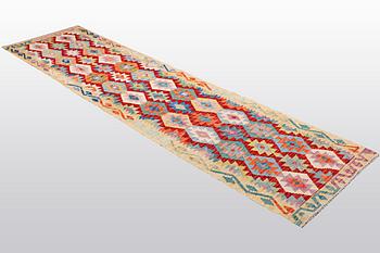 A runner, kilim, ca 314 x 80 cm.