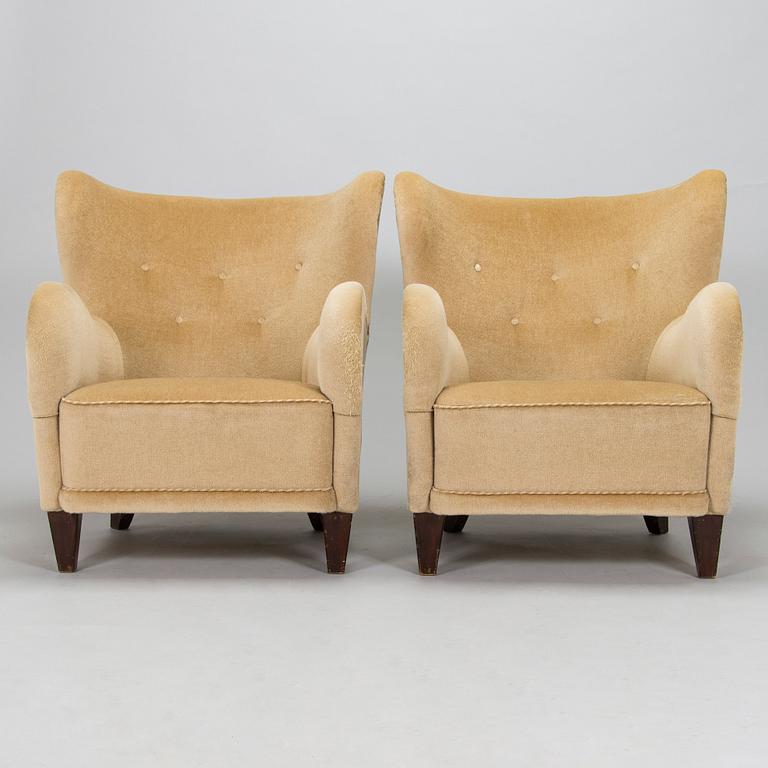 A pair of mid-20th century armchairs.