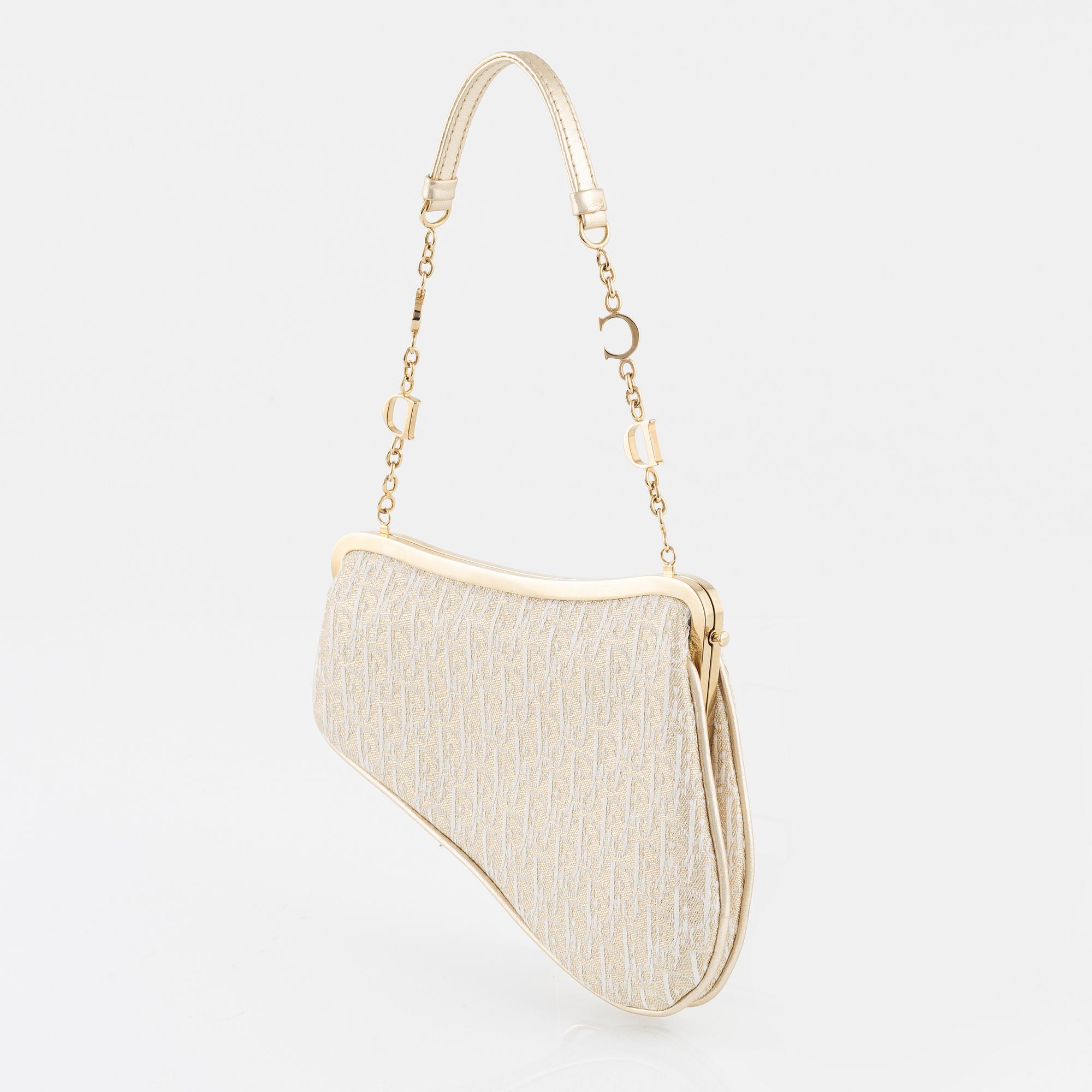 Christian Dior, A vintage 'Mini saddle clutch'.