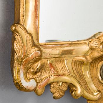 A Rococo mirror sconce, 18th Century.