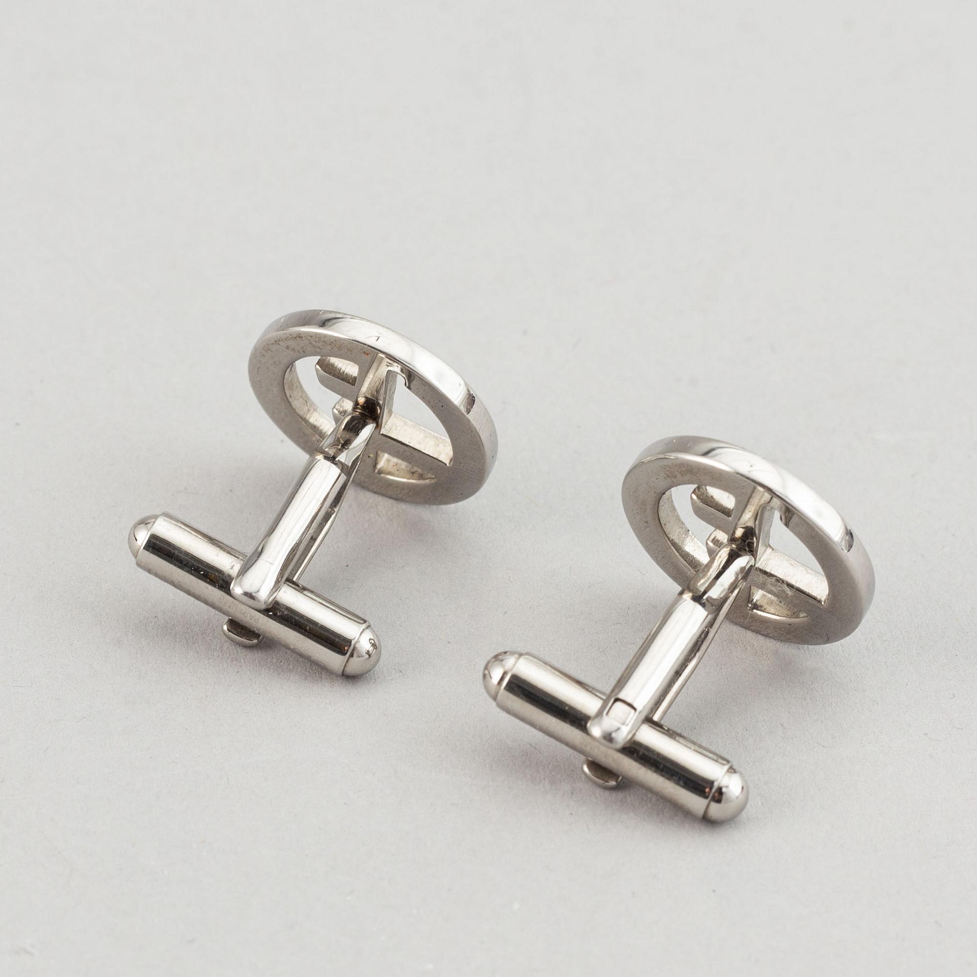 Louis Vuitton and Giorgio Armani, two pairs of cufflinks.