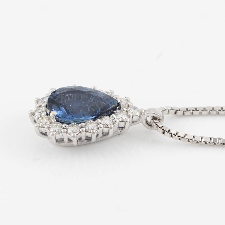 Pendant with 18K gold chain featuring a faceted sapphire and round brilliant-cut diamonds.