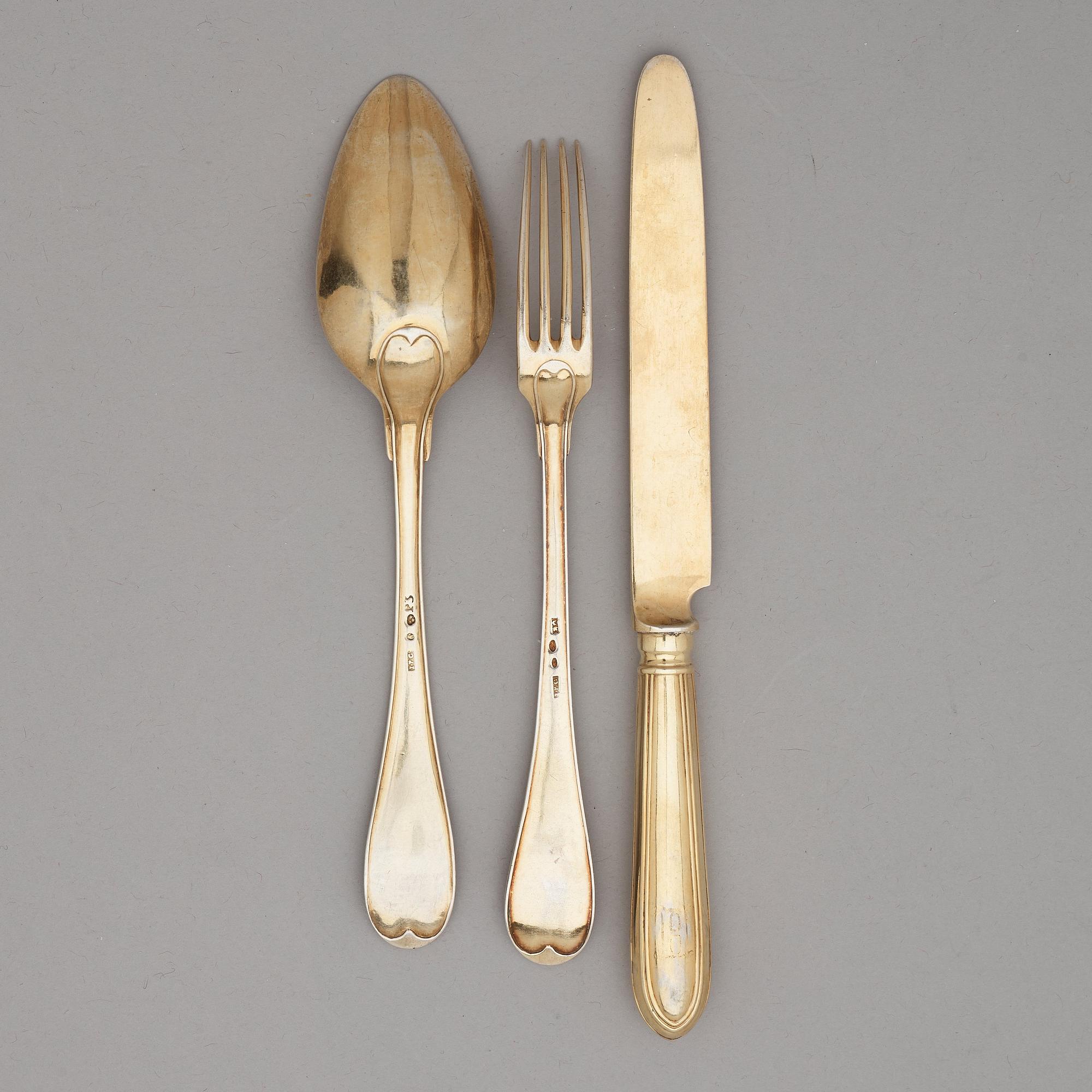 A Swedish 19th / 20th century 36 piece silver-gilt dessert-cutlery, mark of JP Gonvall, Stockholm 1818-1821 and.