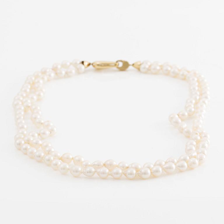 Necklace two rows of cultured pearls clasp 18K gold.