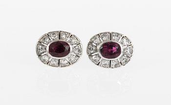 544. EARRINGS, set with rubies and diamonds.