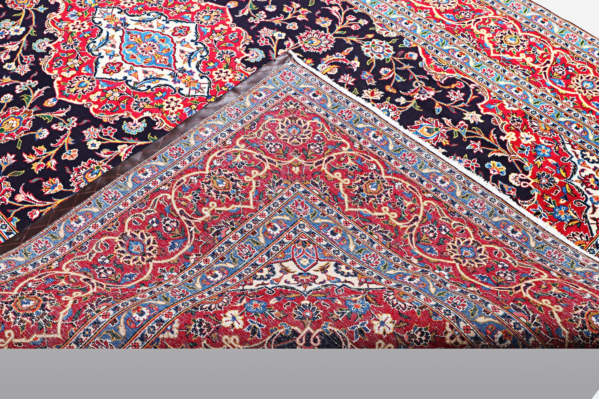 A carpet, Kashan signed Najafi, ca 360 x 231 cm.