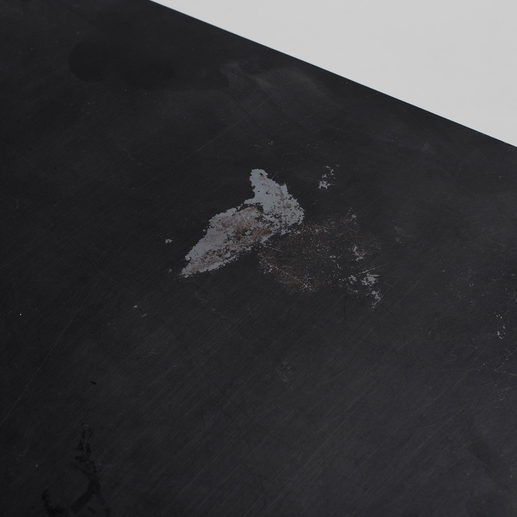 A modern square metal sofa table.