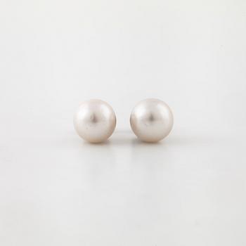 A pair of cultured pearl earrings.