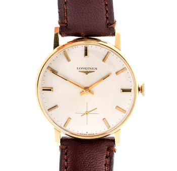 A Longines 18 ct gold wrist watch, ca 32 mm.