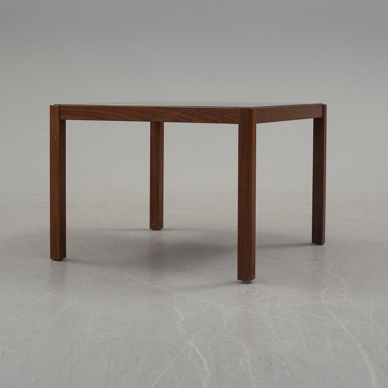 A 1960's teak coffee table with glass top.