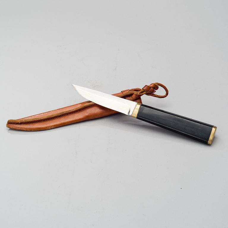 TAPIO WIRKKALA, PUUKKO-KNIFE, stainless steel, nylon and brass, Hackman Finland. Model designed in 1961.