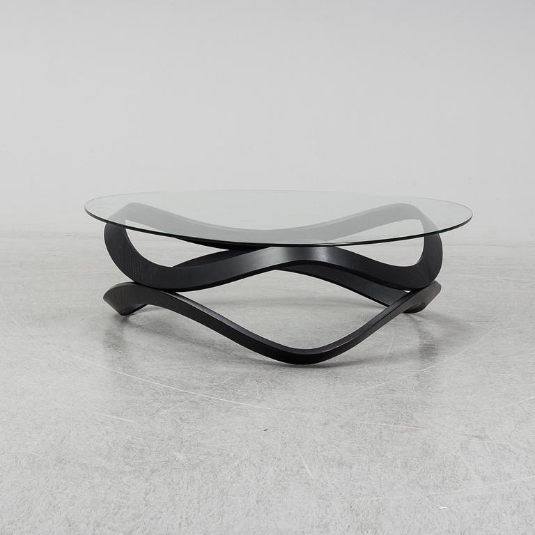 a "Newton" coffee table designed by Dan Sunaga & Staffan Holm in 2009.