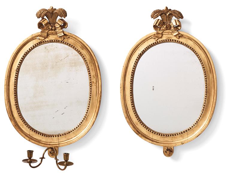 A pair of Gustavian two-light giltwood girandoles by J. Åkerblad (master 1756-1799).