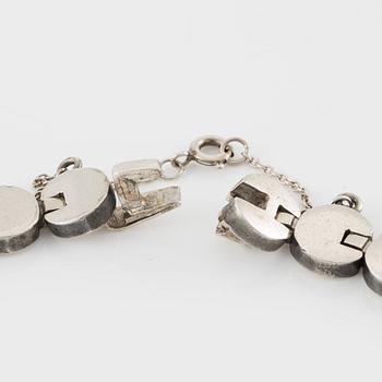 A silver necklace.
