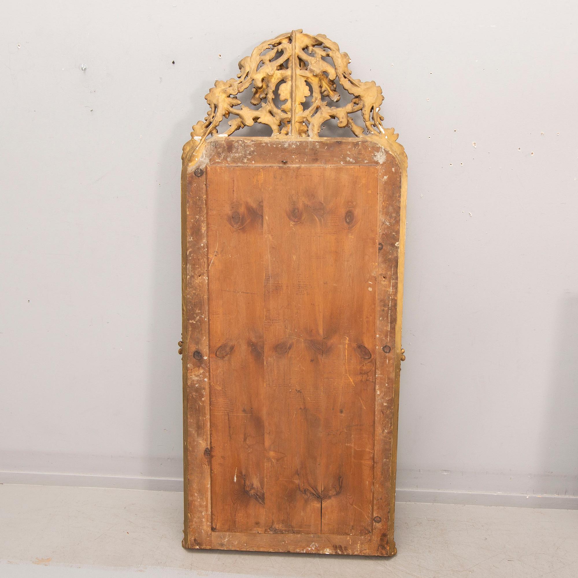 A bronzed Neo Rovovo mirror and table later part of the 19th century.