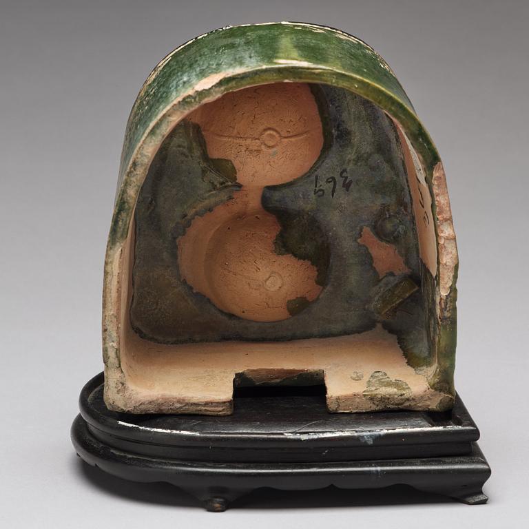 A green glazed pottery model of a stove, Han dynasty (206 BC-220 AD).