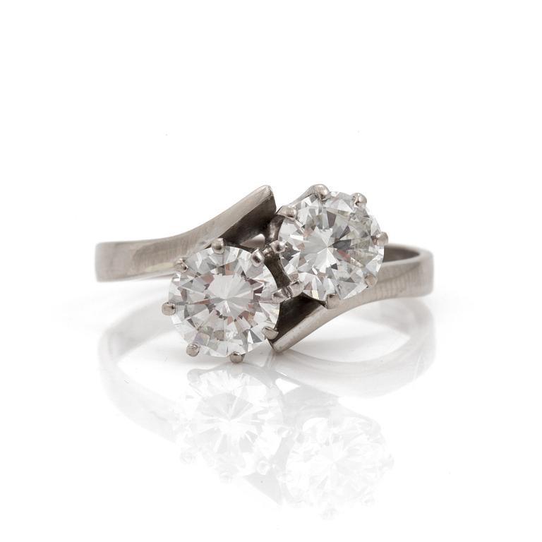 A cross-over ring set with round, brilliant-cut diamonds.