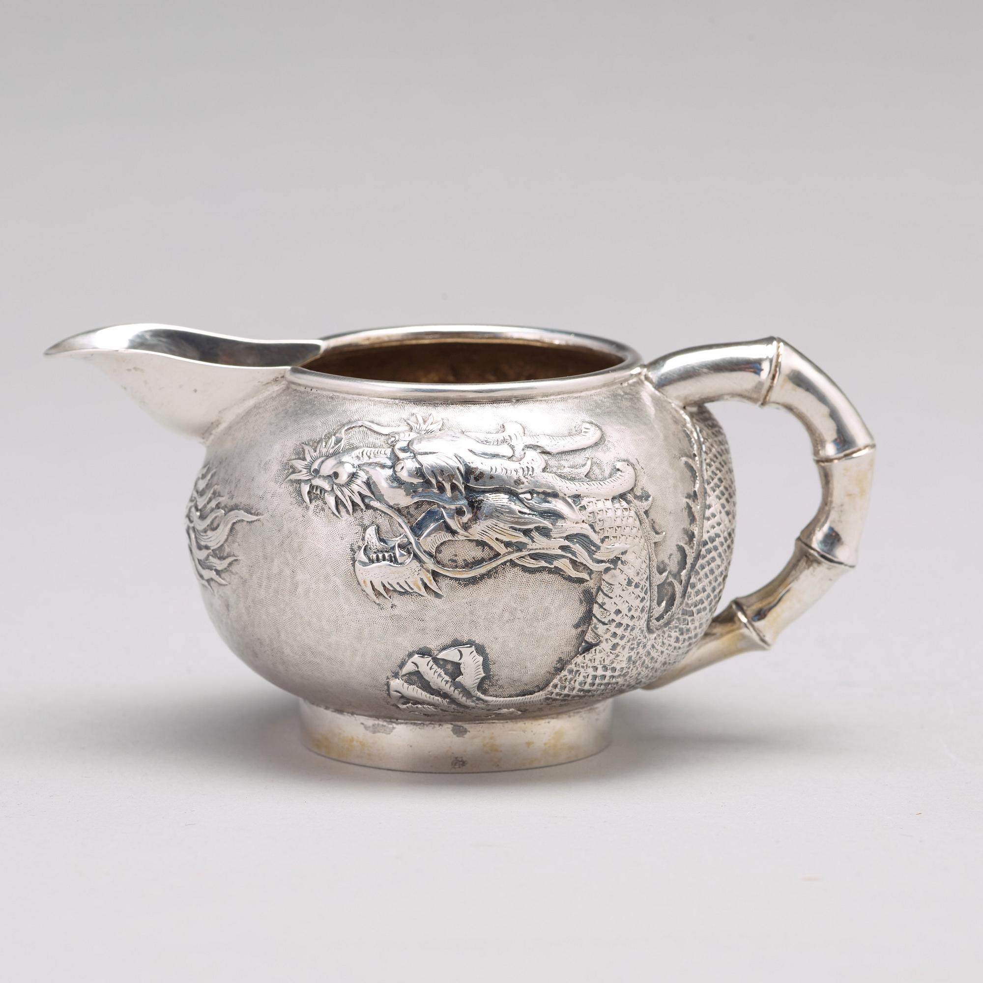 A Chinese four piece silver tea set, Luen Wo, Shanghai, 1875-1925.