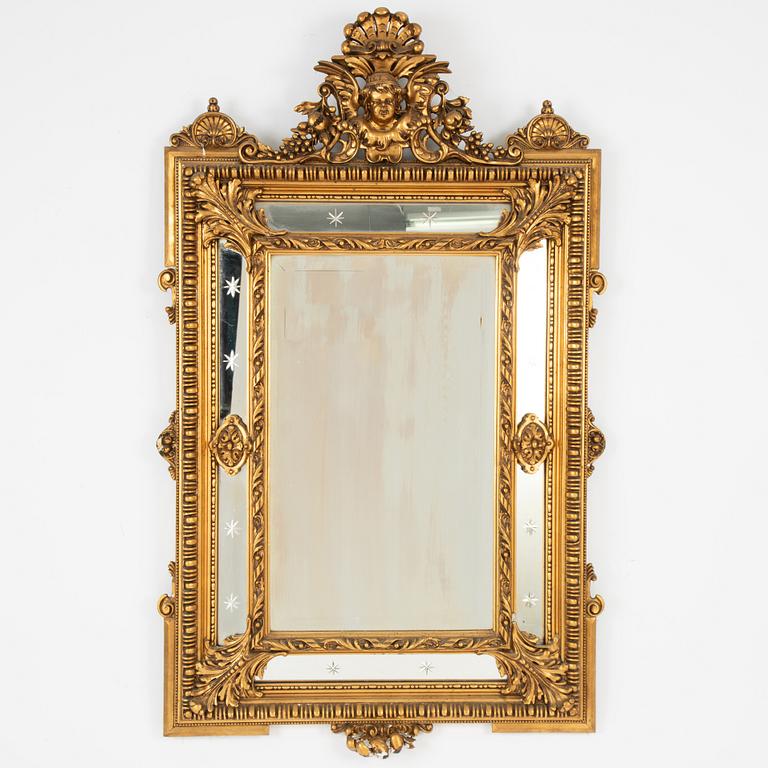 A Baroque style mirror, circa 1900.