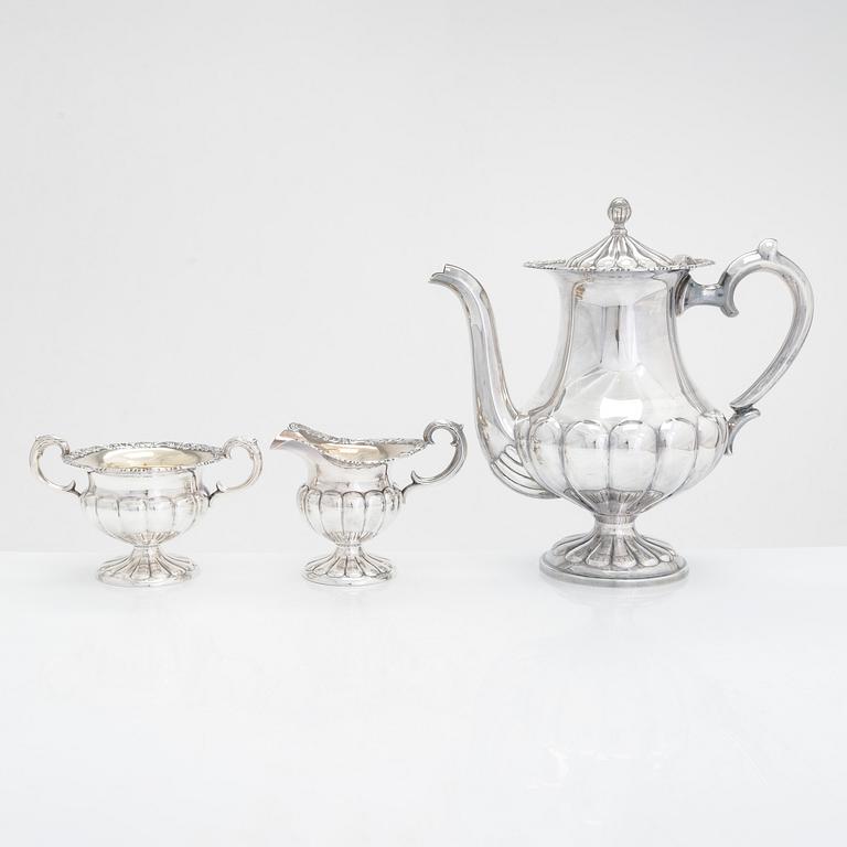Silver sugar tongs, Herman Wist, Uusikirkko, Carelia 1928, a 3-piece coffee service, a candlestick pair, Finland 1950s.