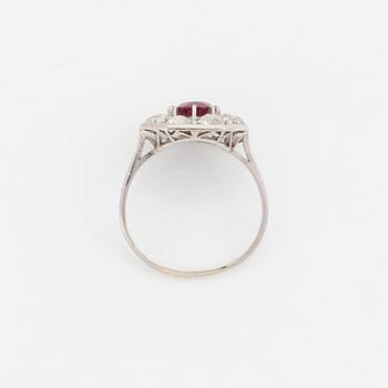 An 18K white gold ring set with a ruby and old-cut diamonds.