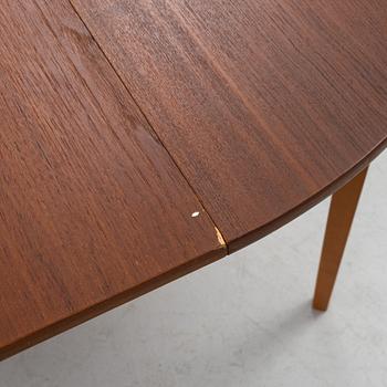 A mid 20th century teak veneer table.