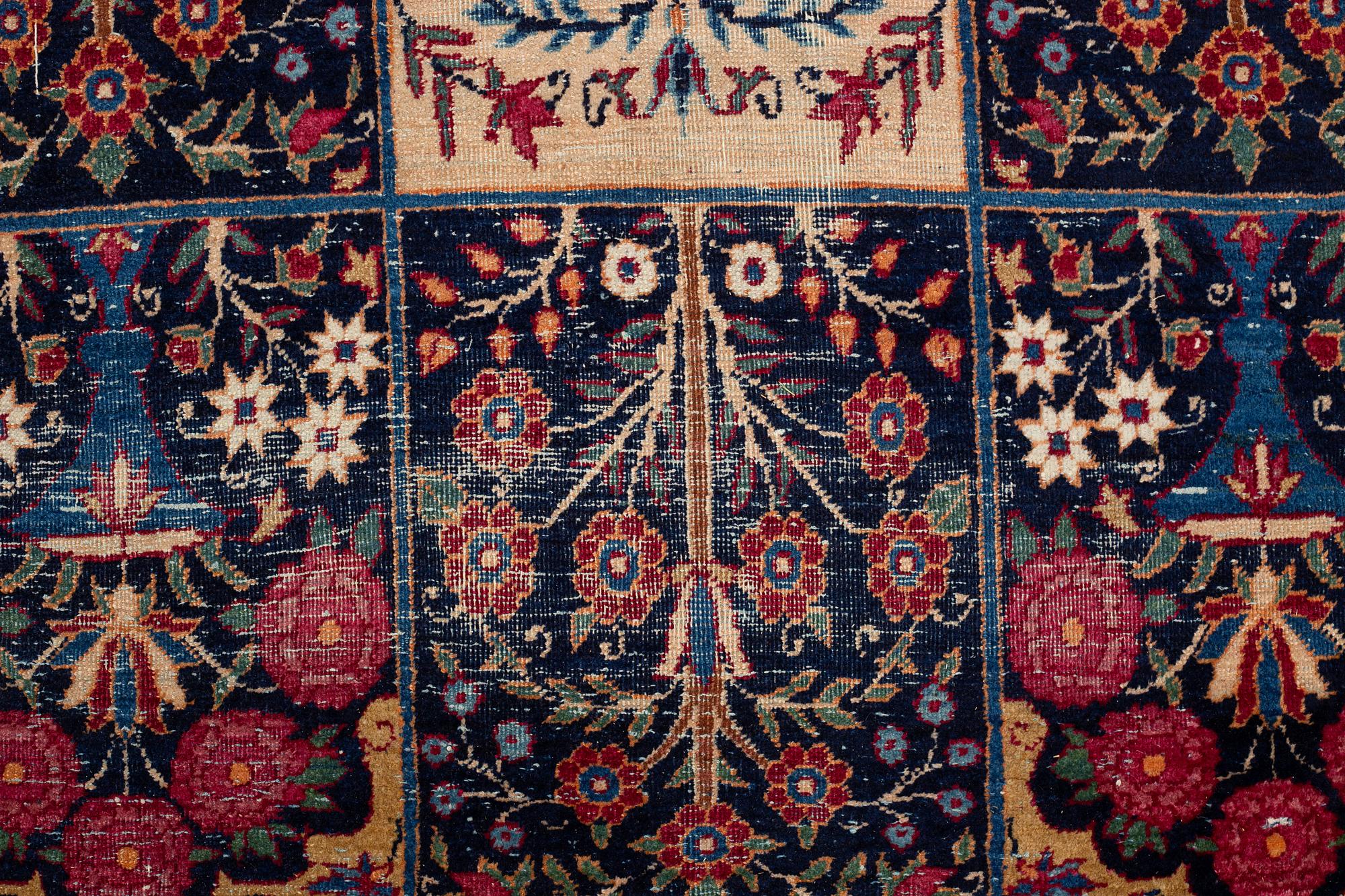 A carpet, an antique/a semi-antique Yezd, ca 557-562 x 366,5-370,5 cm.