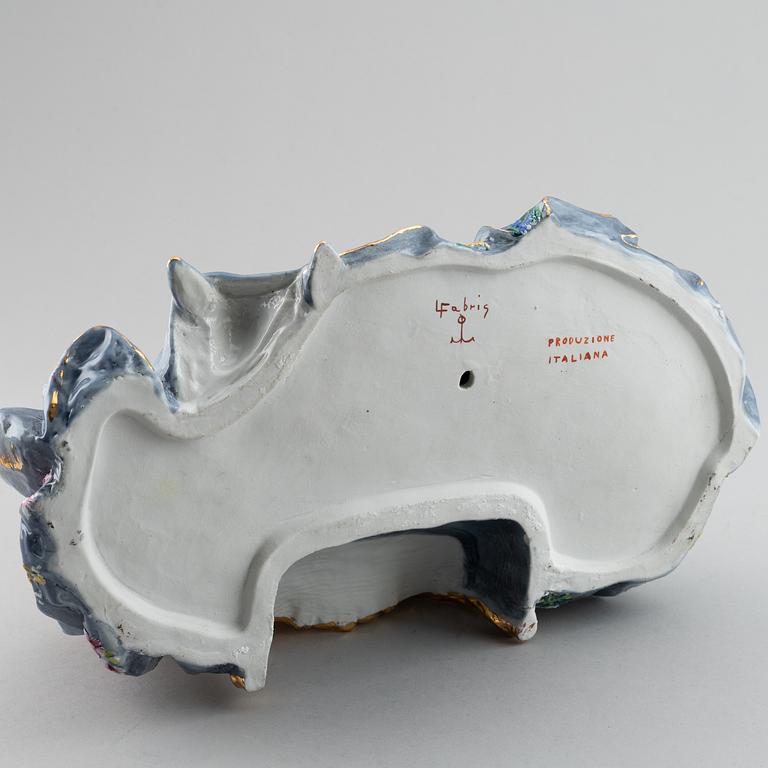 A porcelain figurine of a seated Rococo lady, 20th century, Italy.