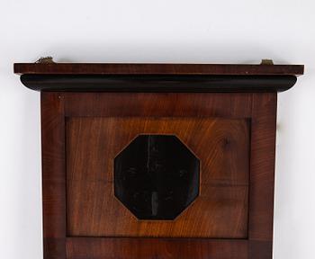 A pair of Biedermeier mahogany mirrors and one console table, 19th century.