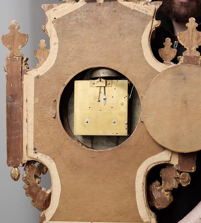 A Gustavian wall clock by Claes Berg, master 1762.