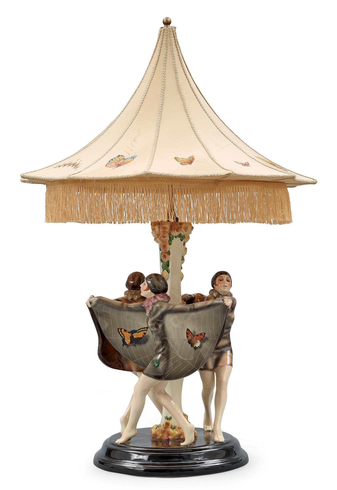 A Josef Lorenzl "The captured bird" triple figural lamp, Goldscheider, Wien circa 1925.