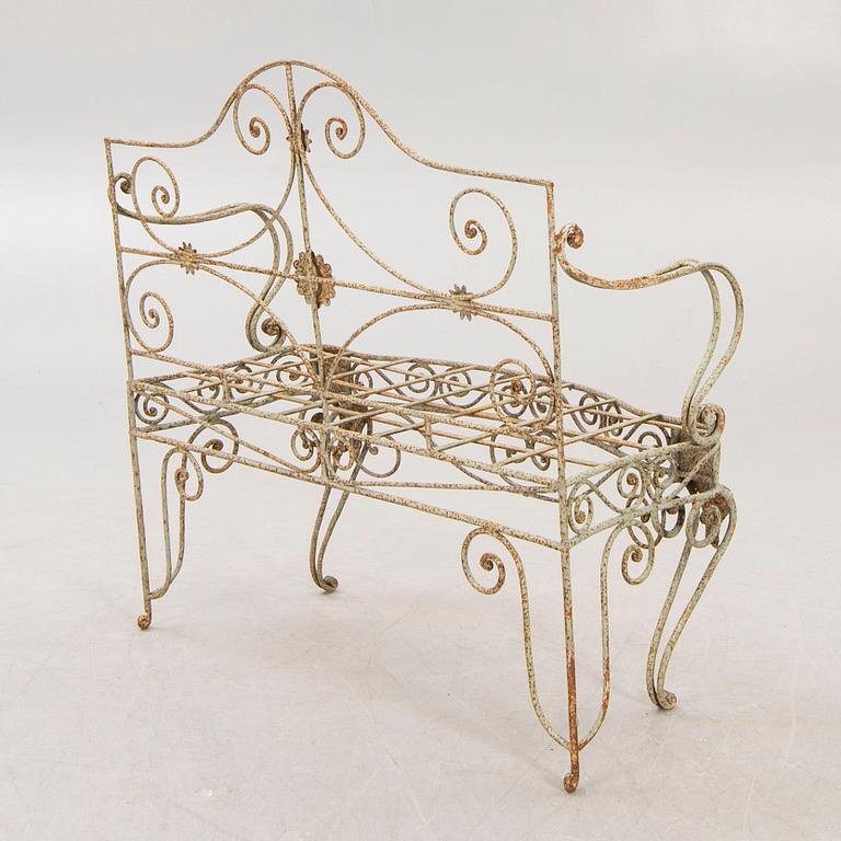 A wrought iron garden sofa, mid 20th century.