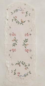 A collection of smaller Christmas tablecloths, runners, and wall hangings, approximately 34 pieces, mid/second half of the 20th century.