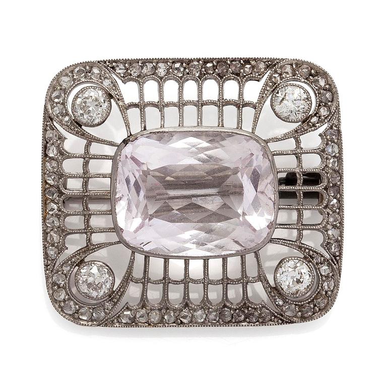 A platinum brooch with morganite and old cut diamonds.