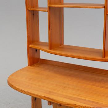 A mid 20th century shelf with table.