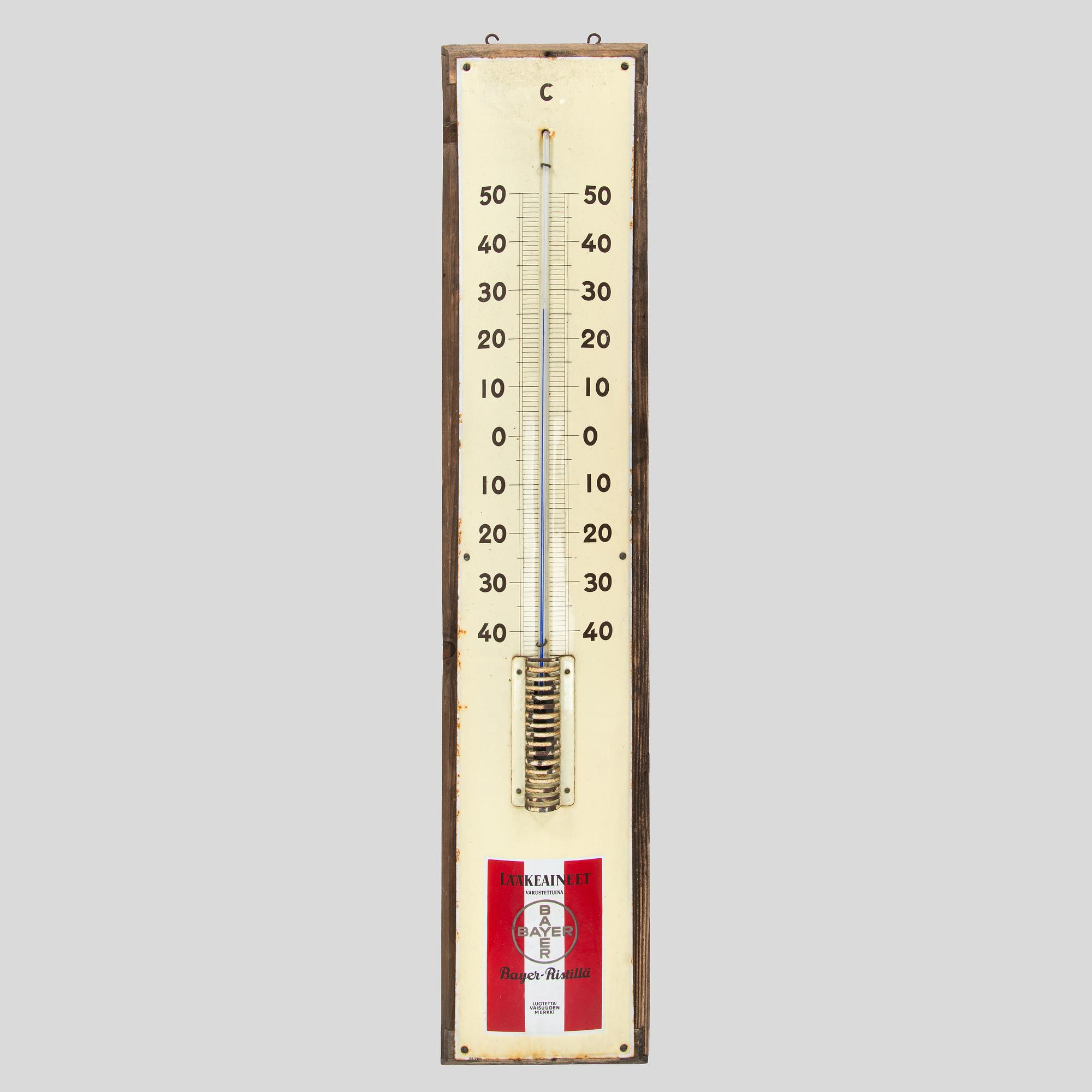 a mid-20th century outdoor thermometer.