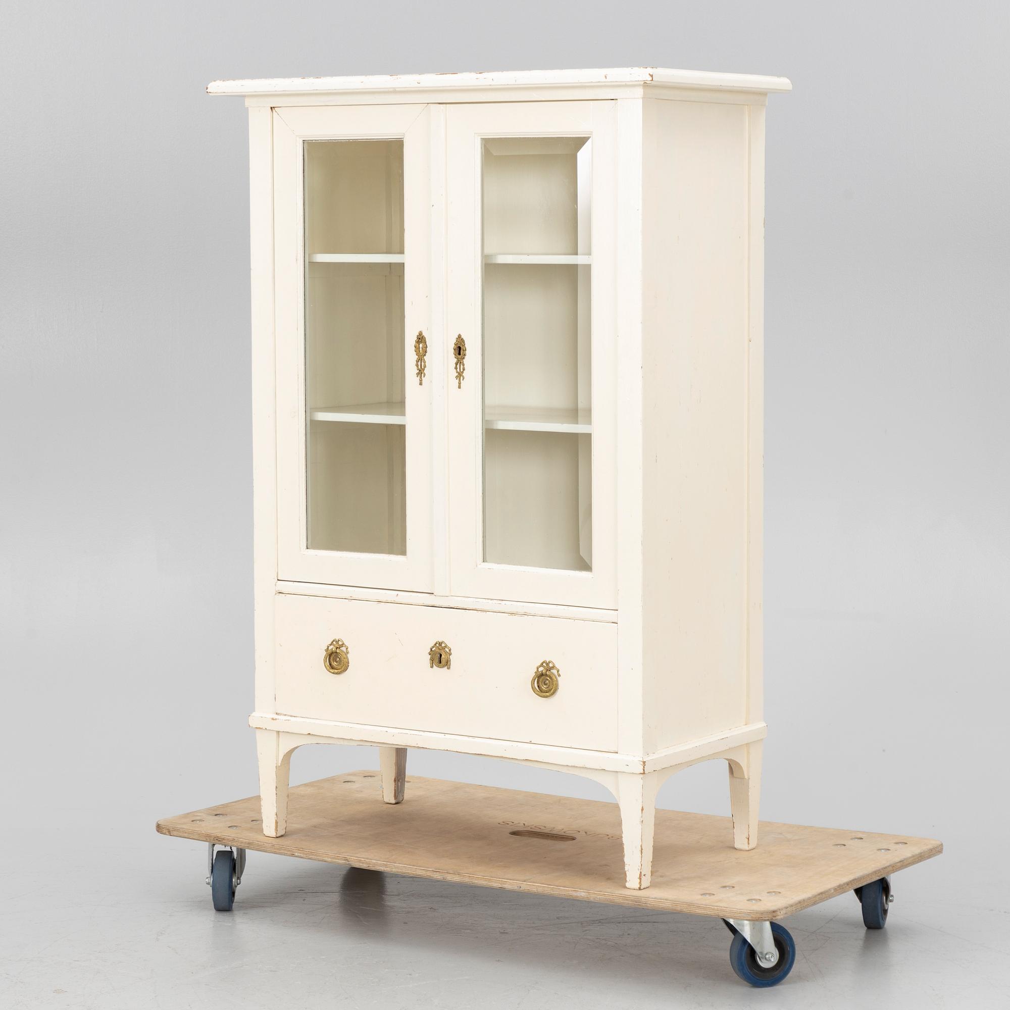 A display cabinet, early 20th century.