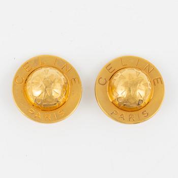 Céline, a pair of clip on earrings.