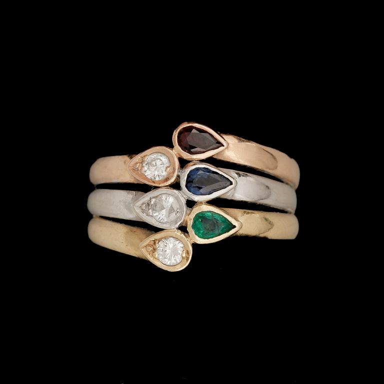 RING, 18k guld trefärgad, med droppformad rubin, safir, smaragd och 3 briljantslipade diamanter tot ca 0,18ct. Vikt 6g.