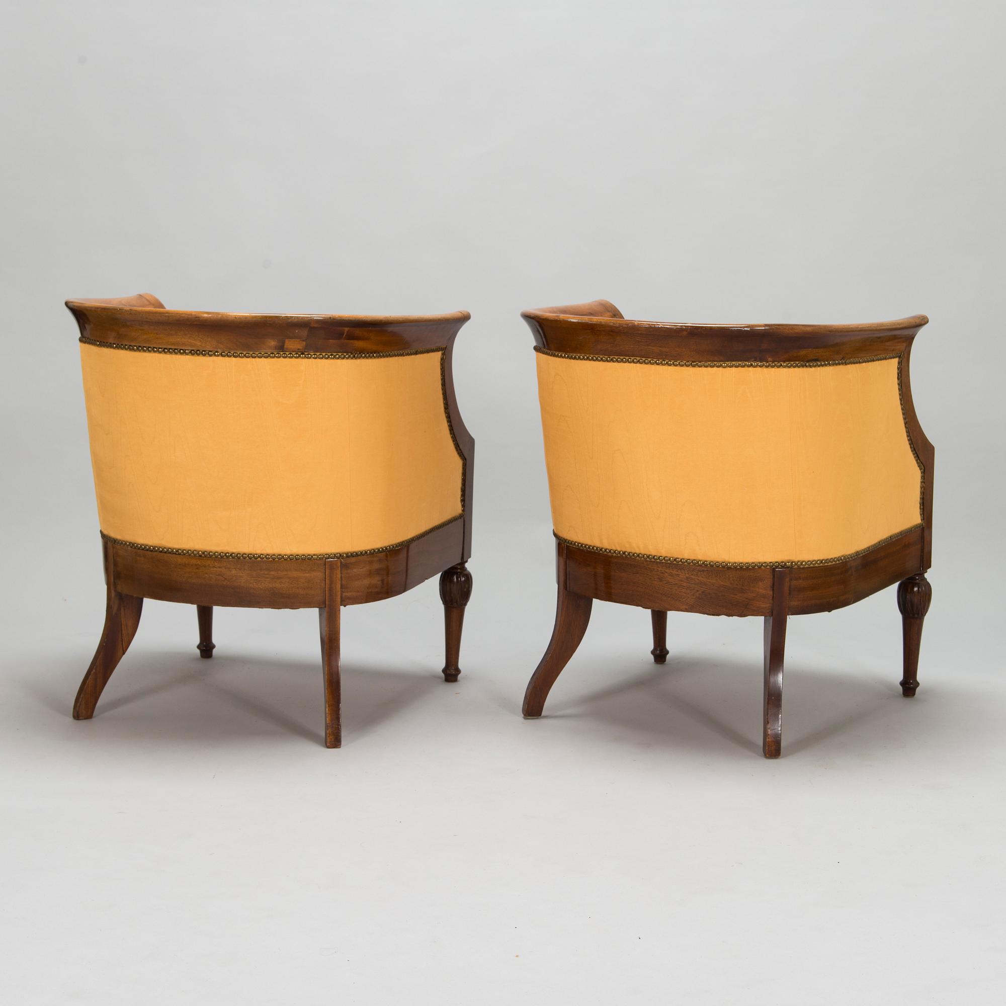 Pair of mahogany and mahogany veneered armchairs, 1920-30s.