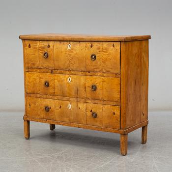 An early 19th century chest of drawers.